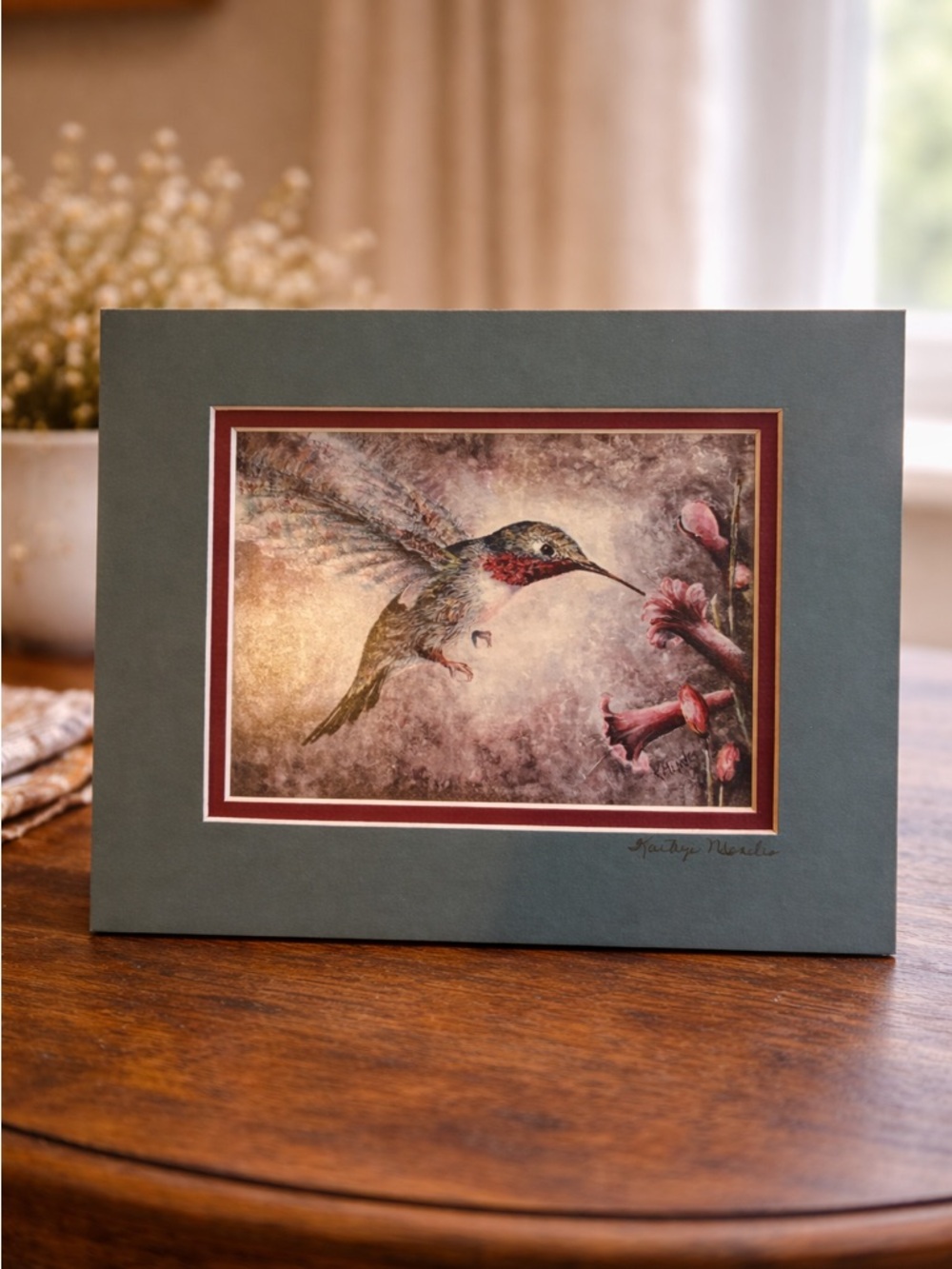 “Hummingbird and Flowers" by artist Katize Mender.